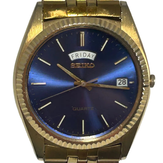 Seiko Gold-Tone Fluted Bezel Blue Dial Day-Date Quartz Watch – Vintage