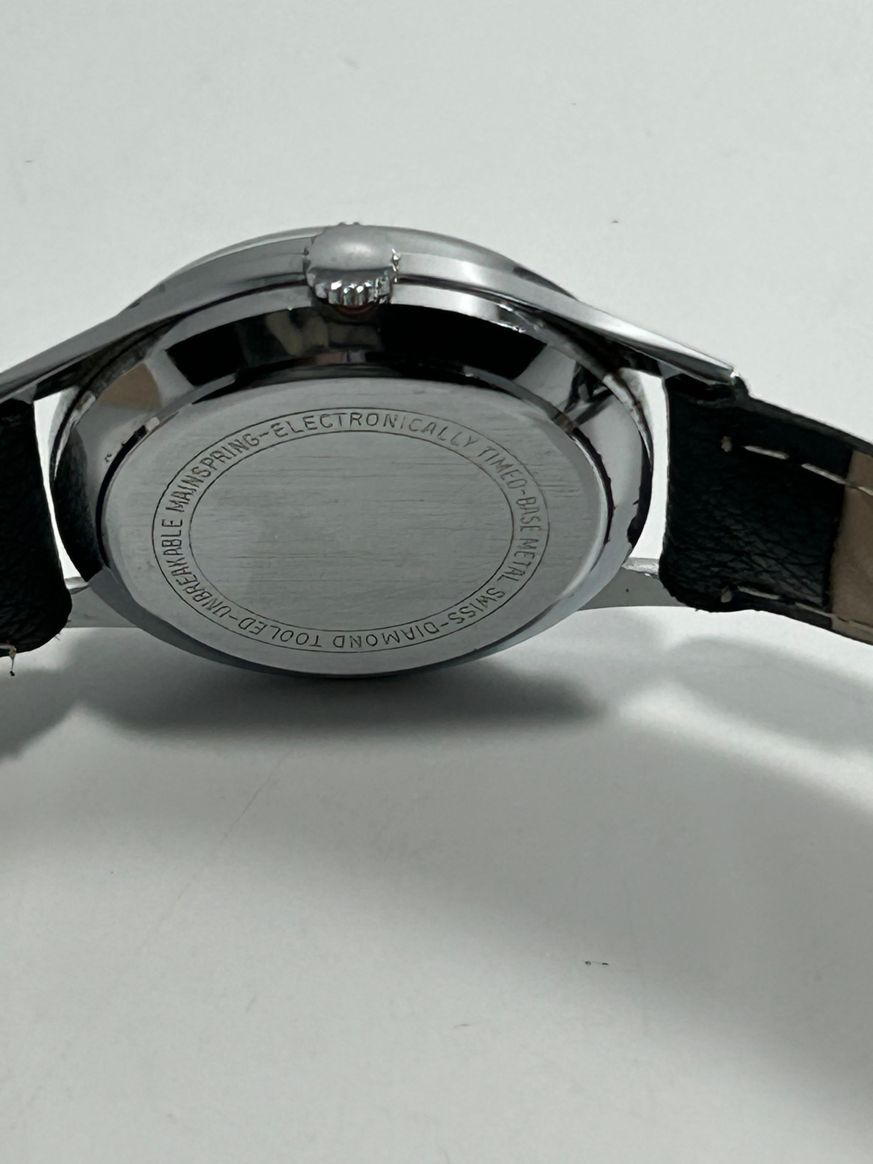 Regus “Living Swiss” Silver Watch - Silver Dial Date Watch, Mid 2000s, 34mm, Mechanical