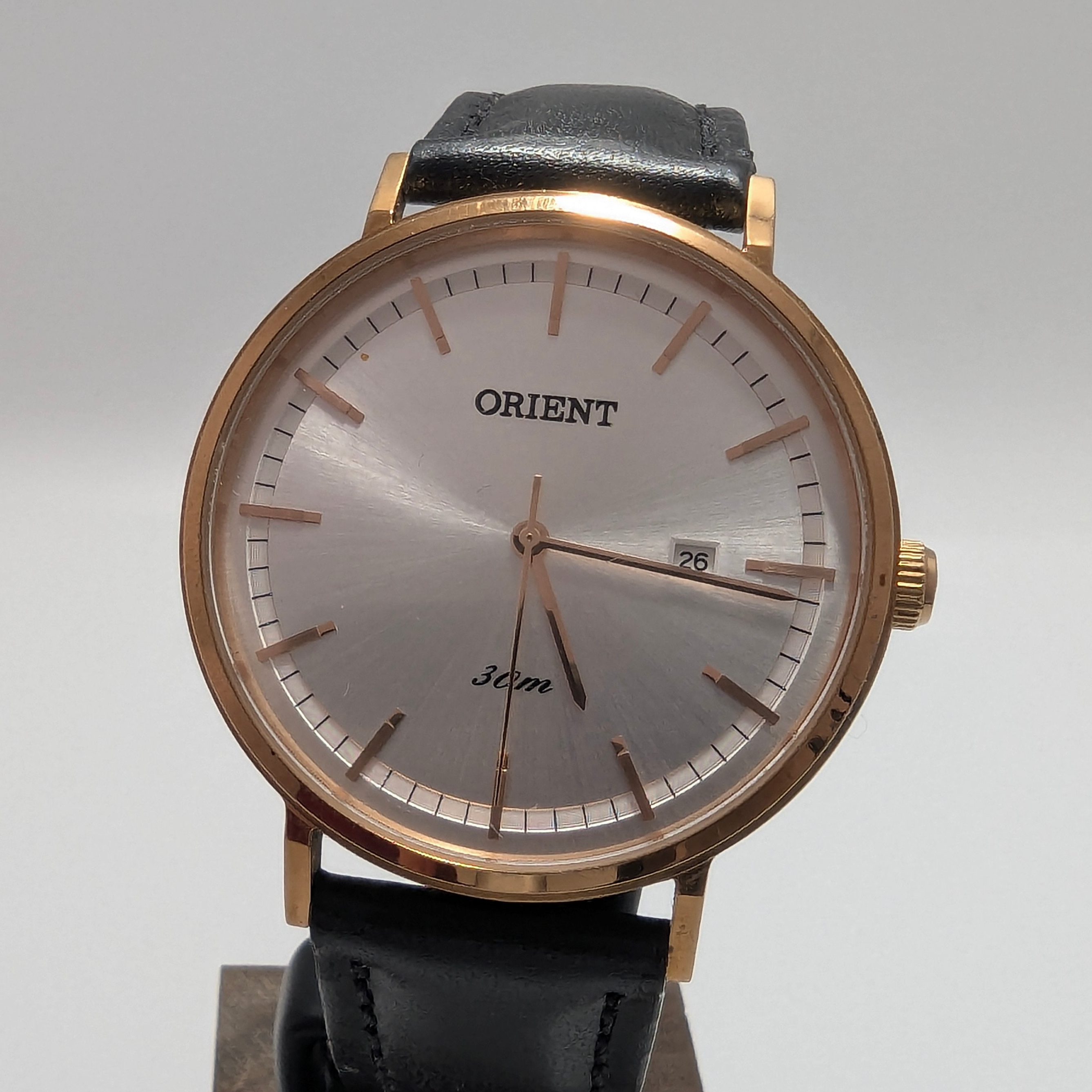 Orient dress watch with rose gold tone case and silver dial on black leather strap 36mm