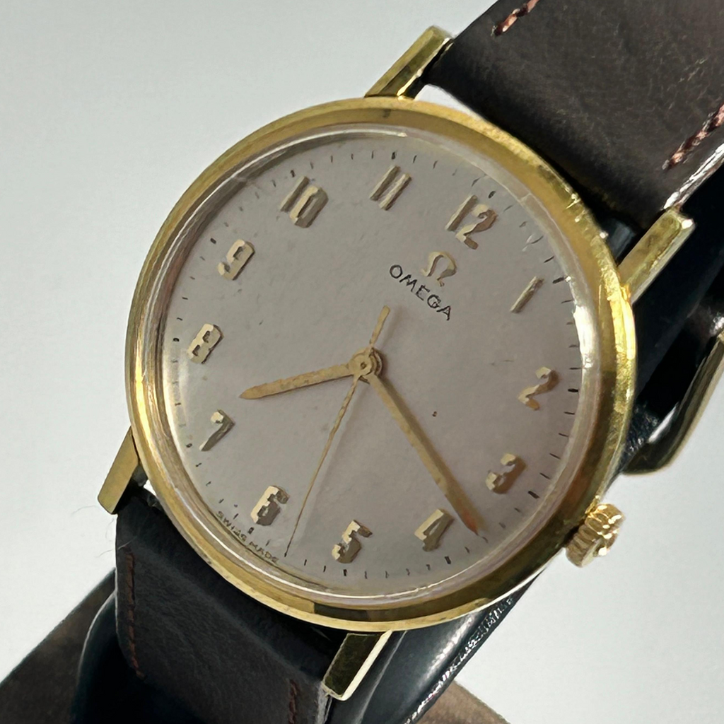 Omega fish scale dial watch with gold case and black leather strap